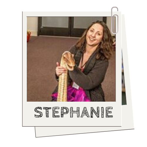Person smiling, holding a large snake indoors, label 'STEPHANIE' below image.